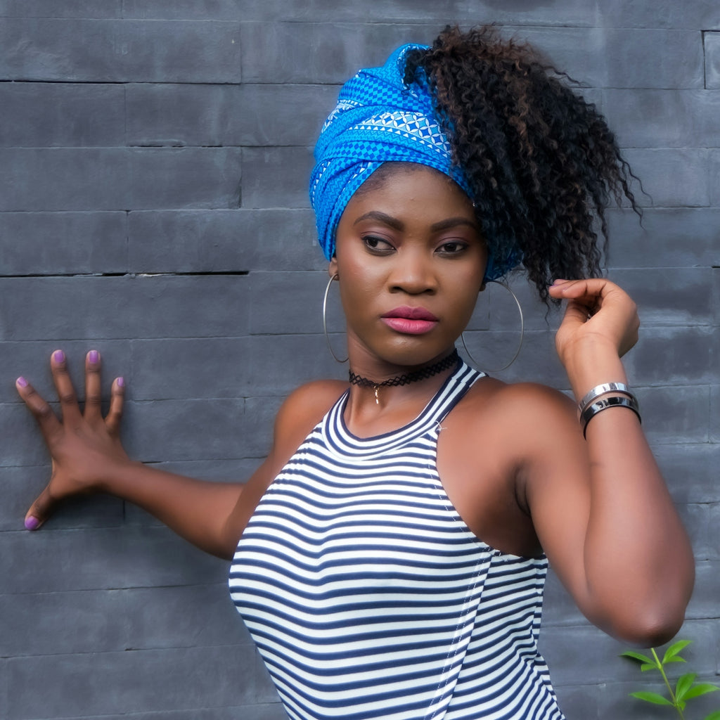 woman in white and black striped top