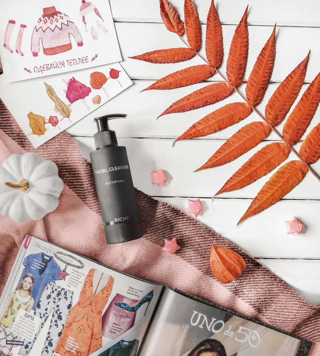 Autumn flat lay with cosmetics and magazines
