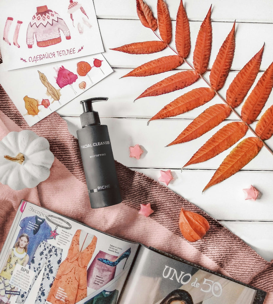 Autumn flat lay with cosmetics and magazines