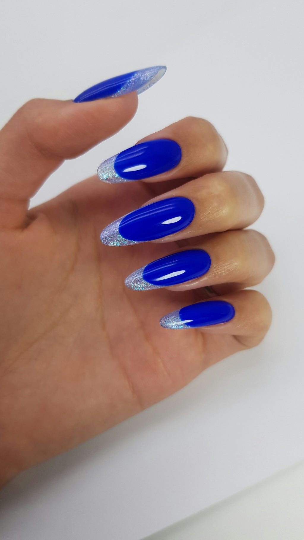 Blue almond-shaped nails with silver french tips